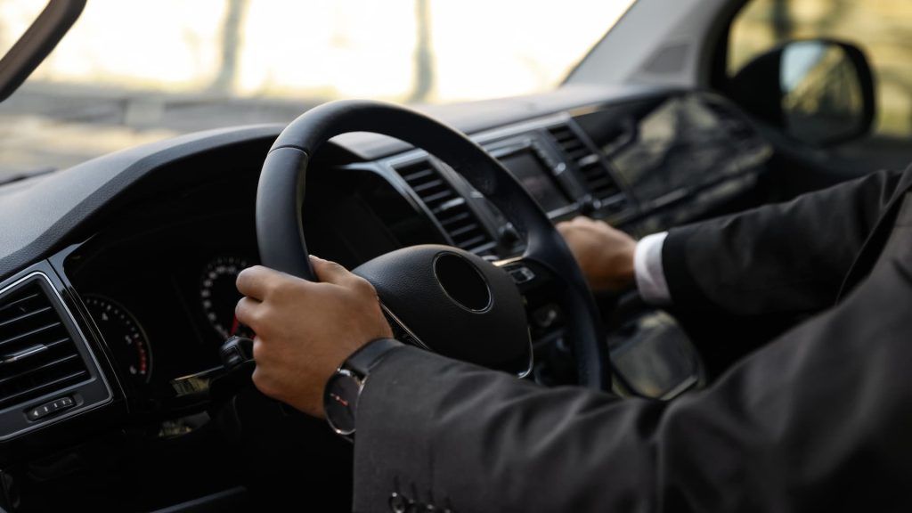 driver turning luxury car on