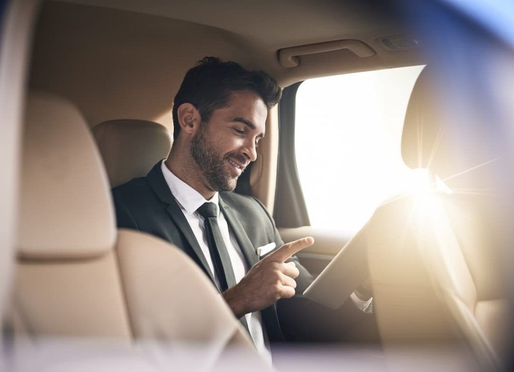 business man in luxury car