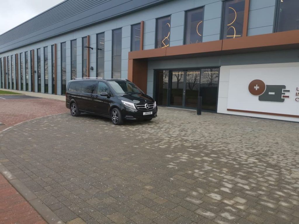 large Mercedes outside an event hall